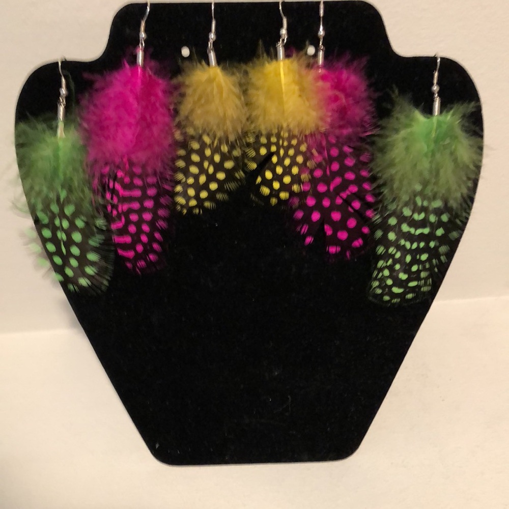 - Three sets of colored feather earrings.  Brand new